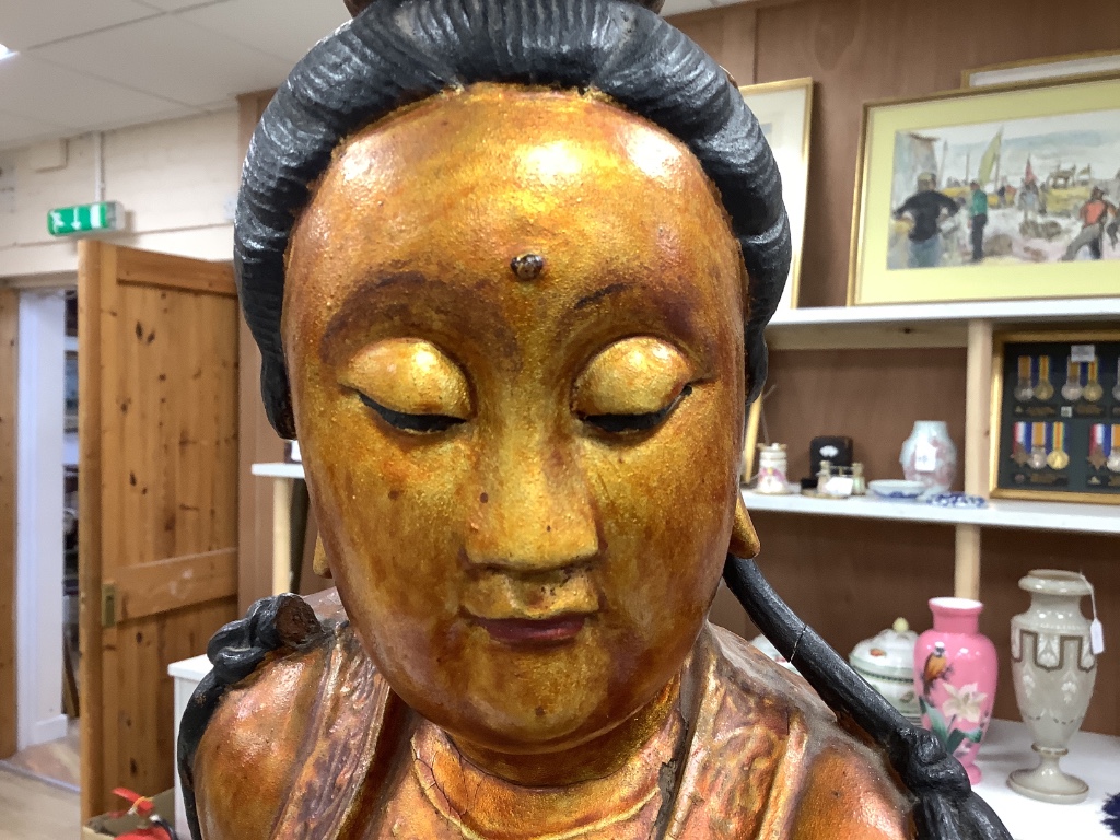 A large Chinese giltwood figure of a lady, height 59cm